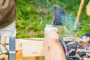 Metal melting and casting. An ancient method of casting from metal kurshey and Vikings. Mini foundry.