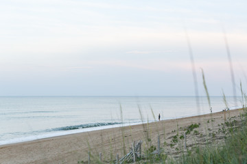 Man Fishing Along The Beach
