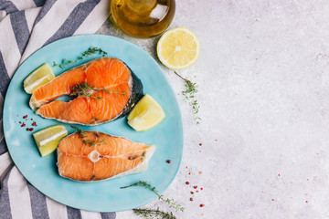 Raw salmon fish steaks with ingredients