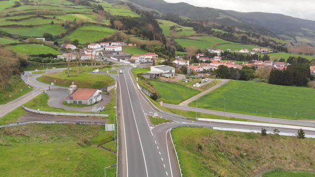 Drone Aerial Portugal Azores Small Mountain Town passing over road to village