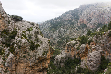 Fototapeta na wymiar Rocks in a valley near Binaraix and cuber reservoir in the Serra de Tramuntana mountains on the Spanish island of Majorca., Mallorca