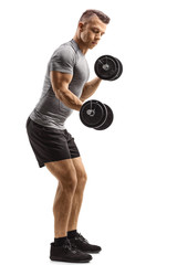 Young fit man lifting dumbbells