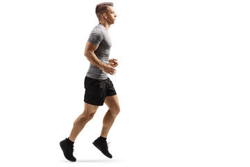Young muscular man jogging