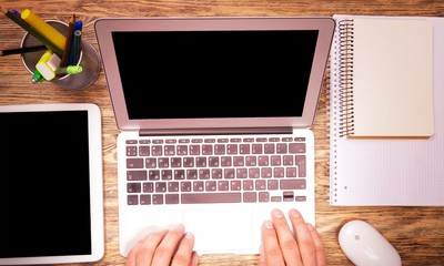 Male hands on laptop on  background
