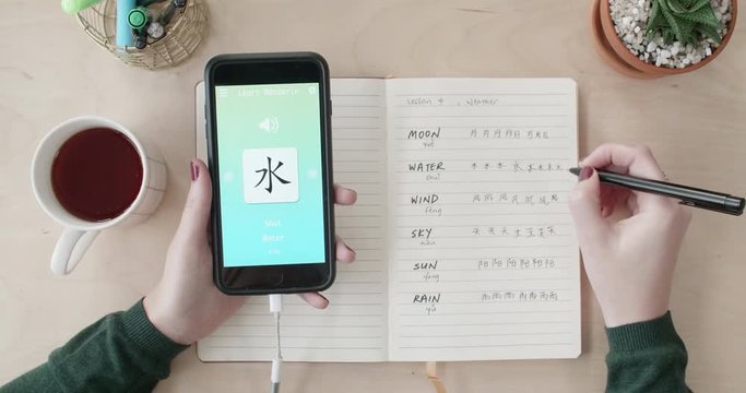 woman using foreign language learn chinese mobile phone app