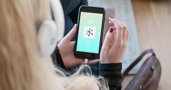 Woman Using Foreign Language Learn Chinese Mobile Phone App