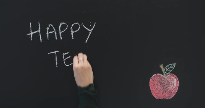 Happy teachers day written on blackboard