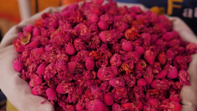 Selection of different arabian spices cosmetics on a traditional Moroccan market souk in Marrakech, Morocco. A lot of pepper, cardamon, cumin, curry