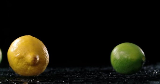Fresh citrus fruit rolling in dark background