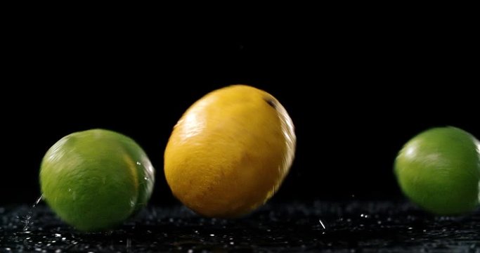 Raw citrus fruit rolling in dark background