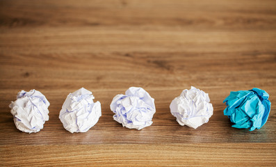 Creative idea concept.Inspiration, New idea and Innovation concept with Crumpled Paper on wood background