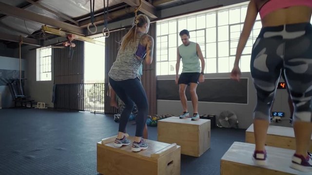 Group of people in crossfit class in gym