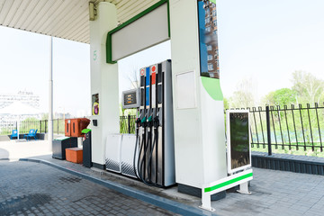 gas pumps with benzine at modern gas station