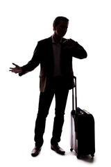 Silhouette of a traveling businessman looking upset because of a delayed or cancelled flight.  The...