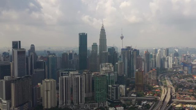 day time flight over kuala lumpur city downtown traffic road junction aerial panorama 4k malaysia