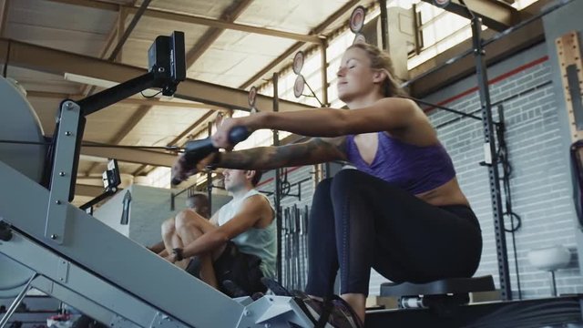 Group of people on rowing machines
