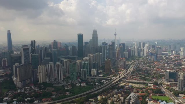 day time flight over kuala lumpur city downtown traffic road junction aerial panorama 4k malaysia