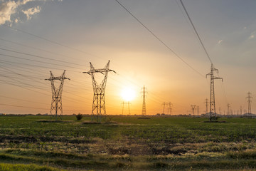 Amazing Sunset view over High-voltage power lines in the land around city of Plovdiv, Bulgaria