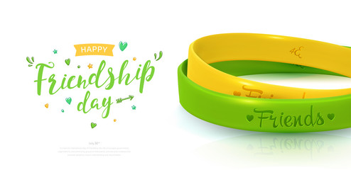 Friendship Day background, happy holiday of amity. Two rubber bracelets for best friends: yellow and green. Silicone wristbands and inscription of congratulations on white background
