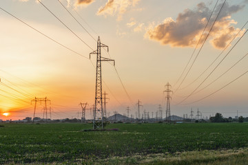 Amazing Sunset view over High-voltage power lines in the land around city of Plovdiv, Bulgaria