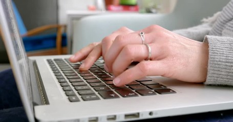 Typing on laptop