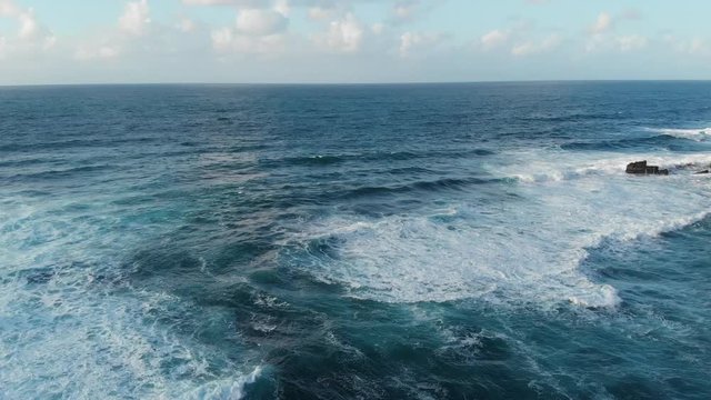 Drone Aerial Portugal Azores Fly out over deep blue ocean on clear day