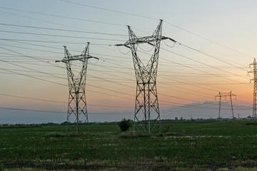 Amazing Sunset view over High-voltage power lines in the land around city of Plovdiv, Bulgaria