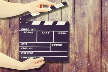 Clap board on wooden background