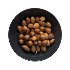 Heap of Macadamia Nuts, Hazelnuts and Almonds in Shell
