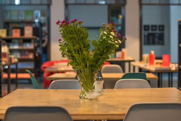 bouquet of flowers lying on a table in a restaurant