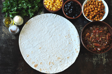 Cooking vegan burrito. Pita bread and a filling for burritos