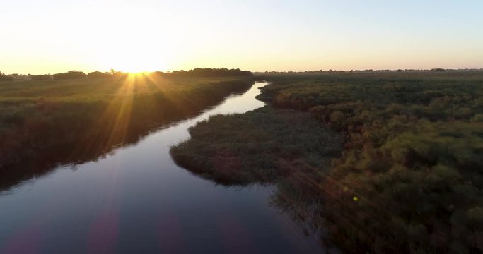 Aerial sunrise view over the waterways of the Okavango Delta
