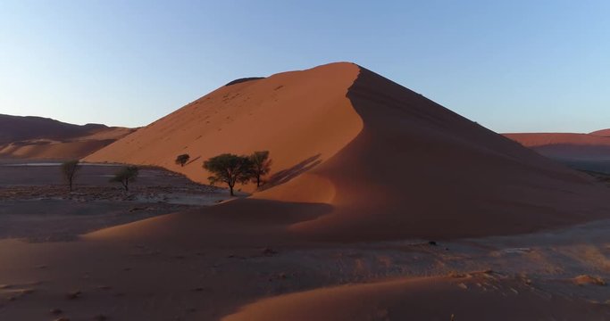 Tilt up aerial view of  one of the vast sand dunes in the Namib desert