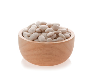 White beans in a wooden cup isolated on a white background.