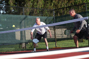 Pickleball is being played outside.