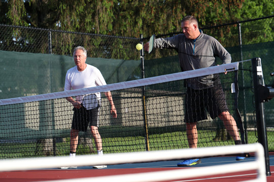 Pickleball is being played outside.
