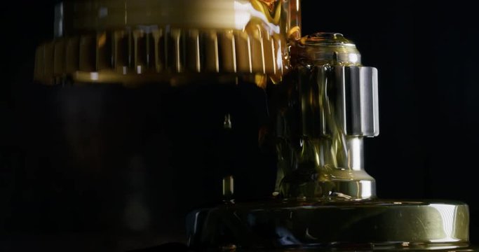 Slow motion macro of specialist is working on production of different gearing details in a workshop in industrial factory.