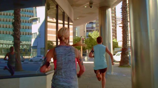 Runners sprinting through the urban city