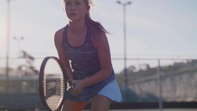 Slow motion portrait of young tennis player