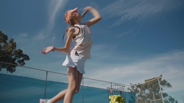Young girl at tennis training