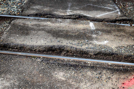 Iron Train Tracks Sunken In The Concrete