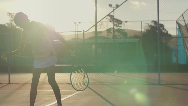 slow motion of tennis player preparing to serve