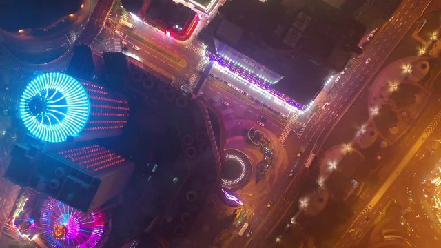 night time illumination macau city famous hotel area aerial topdown panorama 4k china
