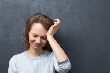 Portrait of upset girl suffering from migraine