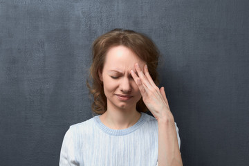 Portrait of upset and suffering young woman