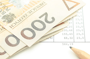 Polish currency money and pencil on spreadsheet. Business concept