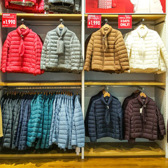 Front of Uniqlo store. Luxury and fashionable brand window display. Winter collection Welcoming the...