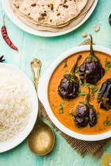 Baingan masala / Eggplant / brinjal curry served with chapati and rice, selective focus