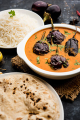 Baingan masala / Eggplant / brinjal curry served with chapati and rice, selective focus
