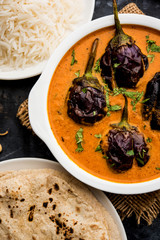 Baingan masala / Eggplant / brinjal curry served with chapati and rice, selective focus